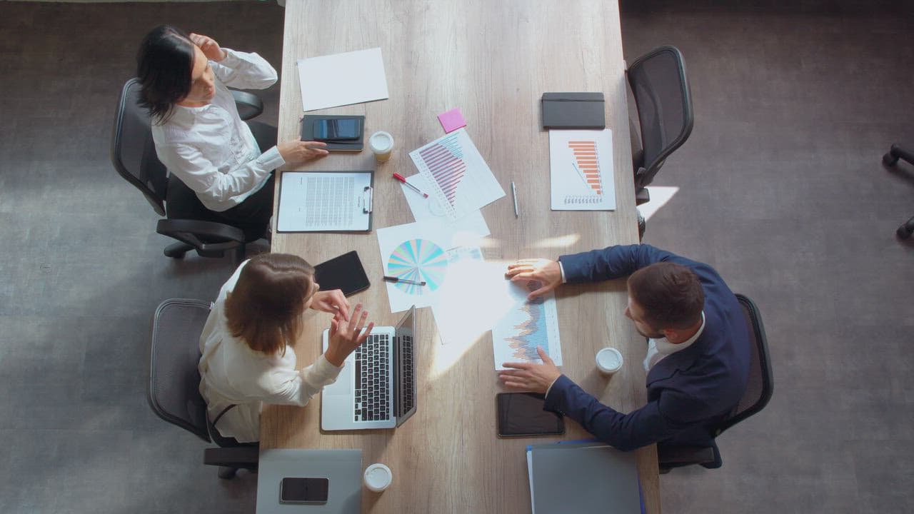 A team coordinating software delivery around a shared workspace